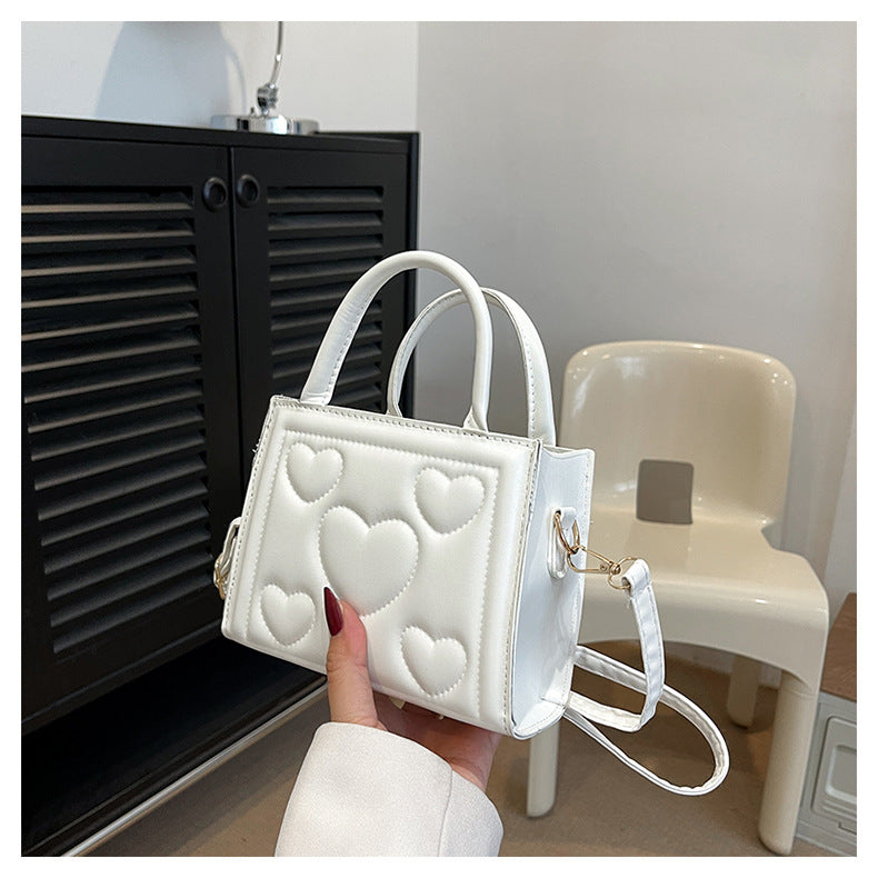 1pc Women’s Stylish Solid Color Handbag with Detachable Strap – Heart Pattern Design, Perfect for Valentine’s Day Gift, Available in Magenta, White, Black, Green, Yellow